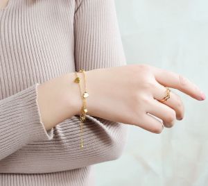 TTN3337  - Lắc tay titan tim dây đôi (màu vàng)