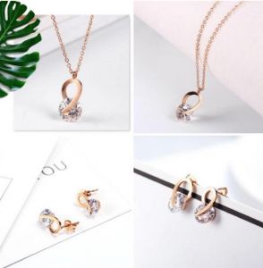 TT3405 - Set titan chéo kẹp đá (vàng hồng)