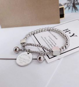 TTN3477 - Lắc tay titan bi NEW YORK 520 (màu trắng)
