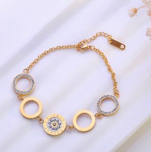 TT4601 - Lắc tay titan vòng tròn khắc BVLGARI (MÀU VÀNG)