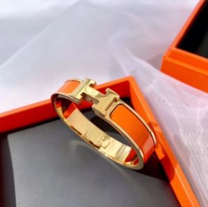 TT4763 - Vòng tay titan HERMES nền cam (Màu vàng/vàng hồng)