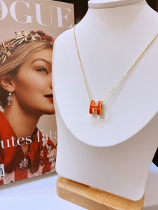 TT4802 - Dây chuyền titan Hermes sơn cam chữ to (màu vàng)