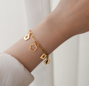 TTN5352 - Lắc tay titan xích hoa rơi (màu vàng)