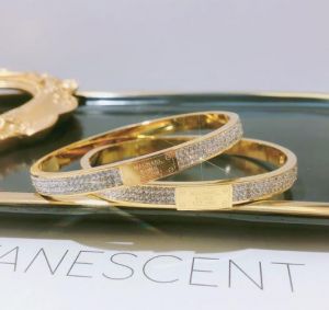 TT5381 - Vòng tay titan MICHAEL KORS 3 hàng xoàn (màu vàng)