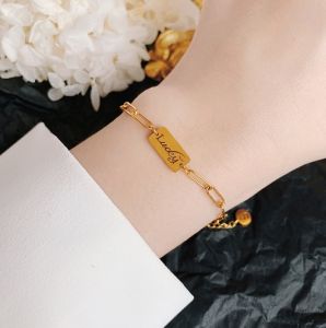 TT5396 - Lắc tay titan xích thẻ chữ Lucky (màu vàng)