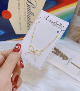 TTN4323 - Dây chuyền titan thắt nơ phối bi ( màu vàng)