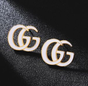 TT4353 - Bông tai titan GUCCI nền trắng (màu vàng)