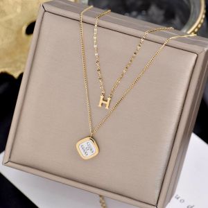 TT4387 - Dây chuyền titan H 2 tầng phối dây trúc (màu vàng)