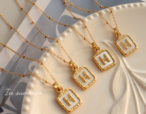 TTC7447 - Dây chuyền titan phối bi mặt vuông H nổi (màu vàng)