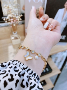 TTN7565 - Lắc tay titan bướm rơi phối đá (màu vàng)
