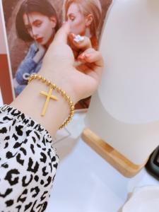TTN7572 - Lắc tay titan bi chữ thập (màu vàng)