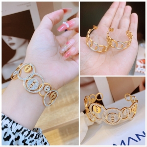 TT7912 - Set titan vòng tròn ghép viền đá (bông tai, vòng tay - màu vàng)