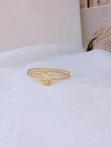 TTN8284 - Vòng tay titan Dior phối đá (màu vàng)