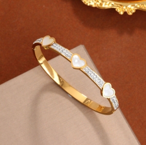 TTC8607 - Vòng tay titan tim xà cừ phối đá (màu vàng)