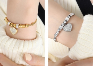 TTN8856 - Lắc tay titan dây rút phối charm (màu trắng / màu vàng)