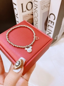 TTN8882 - Lắc tay titan bi Mickey xà cừ (màu trắng)