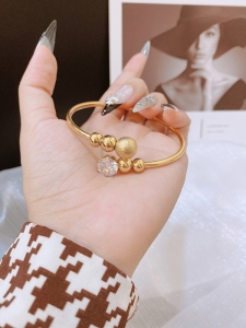 TTC9947 - Vòng tay titan bi phối đá trắng  (màu vàng)