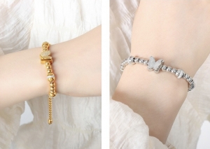 TTN10046 - Lắc tay titan dây rút phối charm (màu trắng/màu vàng)