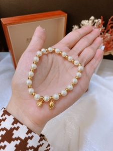 TTC10049 - Lắc tay titan bi mix ngọc trai nụ búp sen (màu vàng)