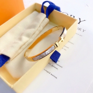 TTC10342 - Vòng tay titan HERMES xà cừ (màu vàng)