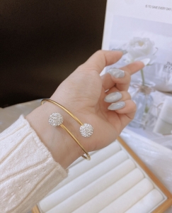 TTN10409 - Vòng tay titan chéo châu bọc đá 2 đầu (màu vàng)