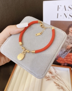 TTN10511 - Lắc tay titan chỉ đỏ mèo Nhật ( màu vàng)