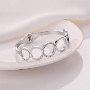 TTC10519 - Vòng tay titan mặt tròn rỗng phối đá (màu trắng)