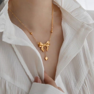 TTN10609 - Dây chuyền titan nơ tim rơi (màu vàng)