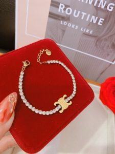 TTC10660 - Lắc tay titan CELINE phối xoàn (màu vàng)
