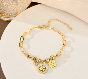 TTC10725 - Lắc tay titan phối charm cỏ 4 lá (màu vàng)