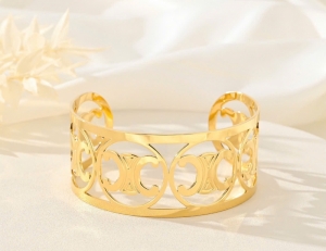 TTC10811 - Vòng tay titan cuff CELINE bản to (màu vàng)