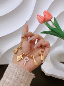 TTC10974 - Lắc tay titan phối charm túi giày son