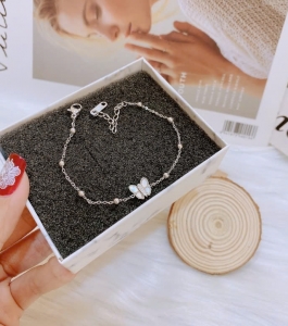 TTN11085 - Lắc tay titan phối bi bướm xà cừ (màu trắng)