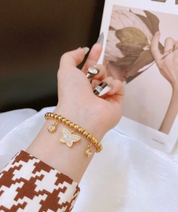 TTN11325  - Lắc tay titan bi phối charm bướm đá dây rút
