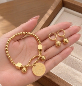 set lắc tay bông tai titan bi